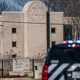 A law enforcement vehicle sits in front of the Congregation Beth Israel synagogue on January 16, 2022 in Colleyville, Texas.