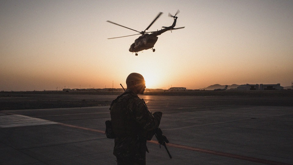 A member of the United States Air Force keeps watch over a runway in Kandahar, Afghanistan, on September 9, 2017.