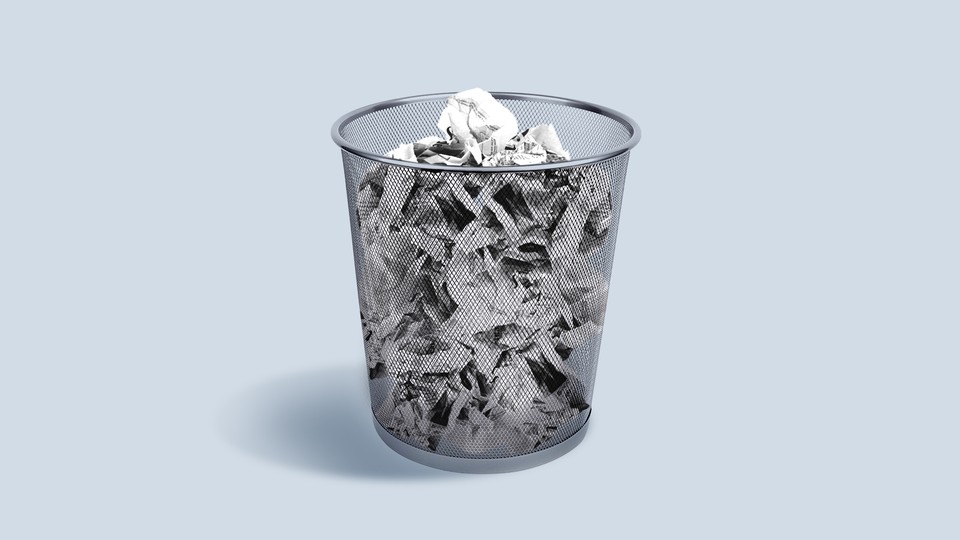 heap of crushed newspaper in waste bin