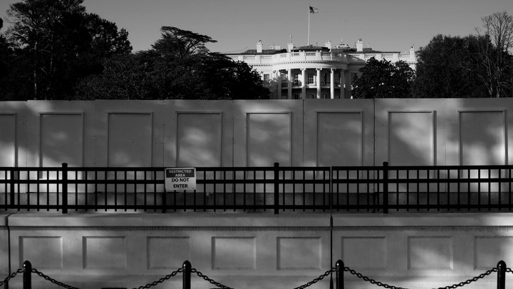 A view of the White House obscured by a wall