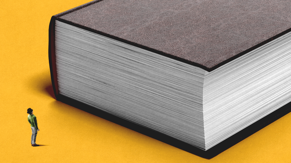 A tiny person looking at a huge book