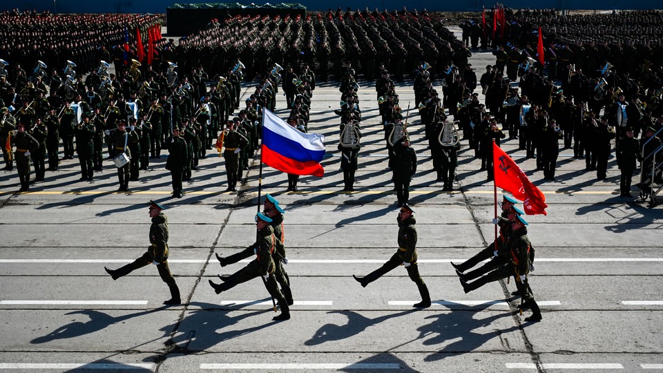 Russian soldiers march in a parade.