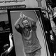 Black-and-white photograph of a rally with demonstrators carrying a photograph of Marwan Barghouti