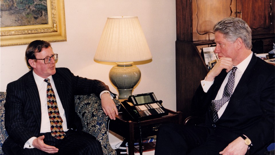 David Trimble sits on a sofa across from Bill Clinton