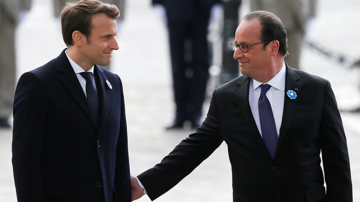 President-elect Emmanuel Macron and outgoing President François Hollande mark the anniversary of Nazi Germany’s defeat in World War II at the Arc de Triomphe in Paris on May 8, 2017.