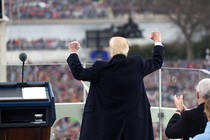 President Trump pumps his fists into the air.