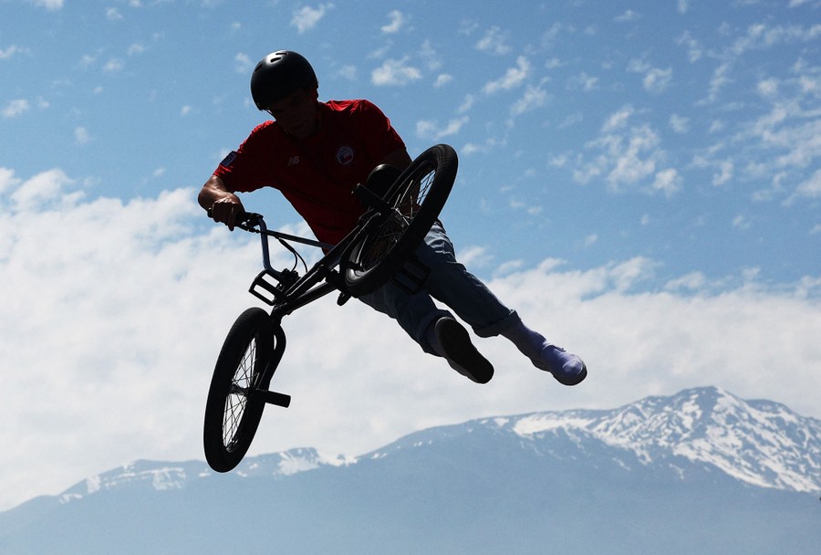 A man flips a bike mid-air.