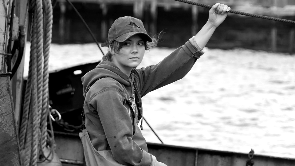 Emilia Jones, who plays Ruby in the film "CODA," sits on her family's fishing boat.