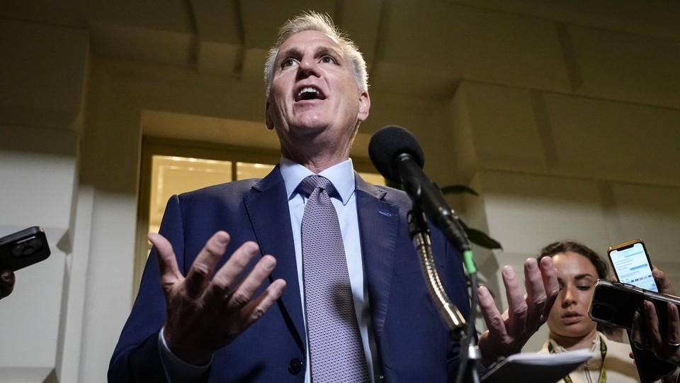 Kevin McCarthy stands at a lectern