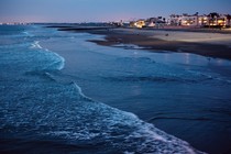 A day before the January 2018 king tide, waves break in front of condos along Imperial Beach's shoreline.
