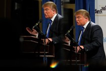 Donald Trump is reflected in mirrors while speaking at the Greater Nashua Chamber of Commerce Expo in 2011.