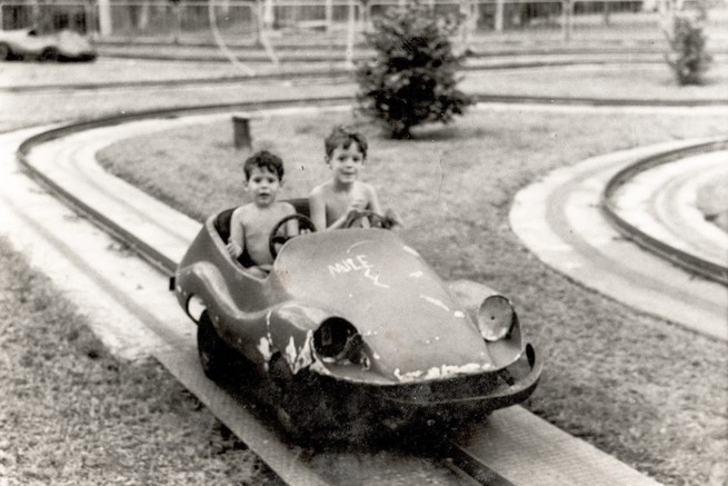 Author with his brother in an amusement park.