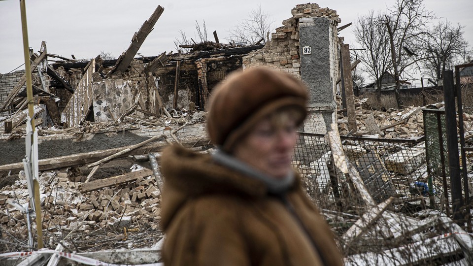 A view of a destroyed house in Kupriyanivka Village, due to the airstrikes carried out by the Russian Army, as citizens try to save the items that remain intact, in Zaporizhzhia, Ukraine on December 07, 2022.
