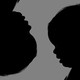 Silhouettes of babies' heads, one of which is upside down