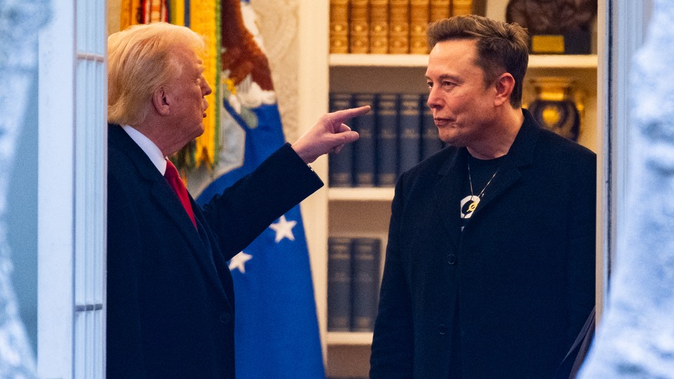 Color photograph of Donald Trump gesturing his left hand toward Elon Musk as they stand talking.