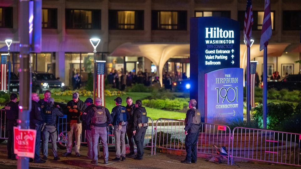 A photograph of FBI agents gathered outside of the Washington Hilton.