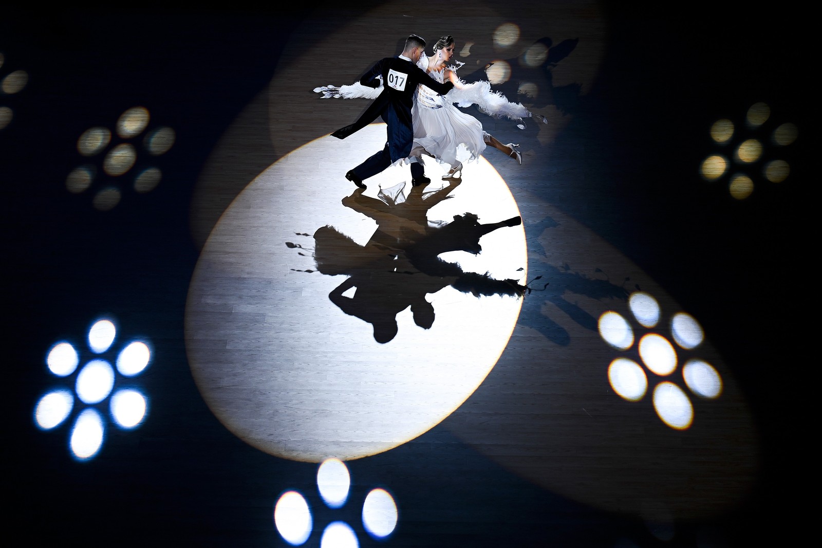 An elevated view of competitive dancers during a performance