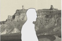 Silhouette of man against Libyan landscape