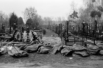 Body bags lie in a cemetery in Bucha, Ukraine.