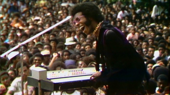 A still of a concert performance from the documentary Summer of Soul