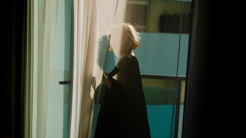 A photo of a woman with face obscured