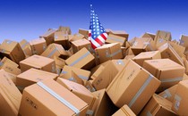 An American flag drowning in cardboard boxes