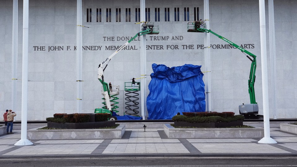 Color photo of the Kennedy Center sign under construction.