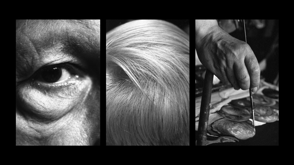 Close-up of eye, hair, and painting hand