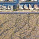 A color aerial photograph of desert landscape abutting a suburban neighborhood