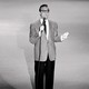 Steve Allen on stage with a spotlight