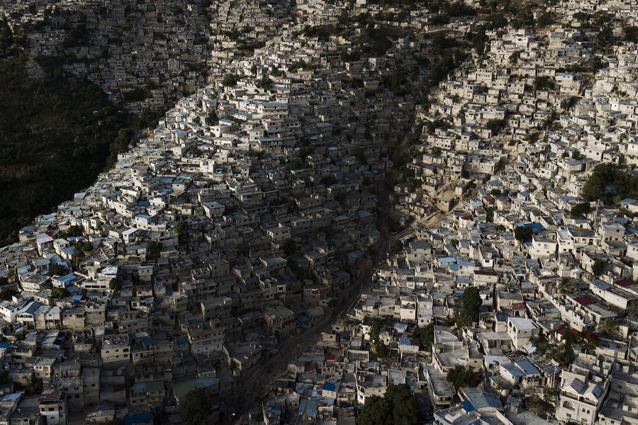 Homes stand densely packed on a hillside neighborhood of Port-au-Prince.