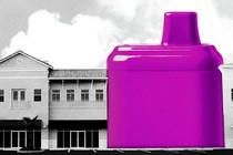A giant vape in a line of storefronts