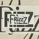 Photo of paper cut-outs of the word "rizz" layered on top of one another