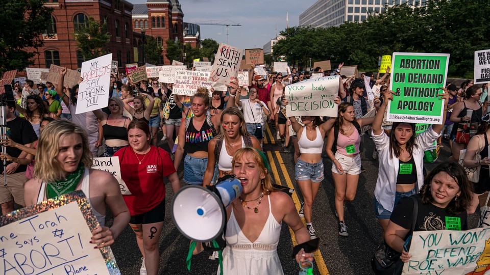 Abortion-rights activists march toward the White House on June 26.