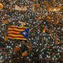 Protesters wave Estelada flags during a demonstration.