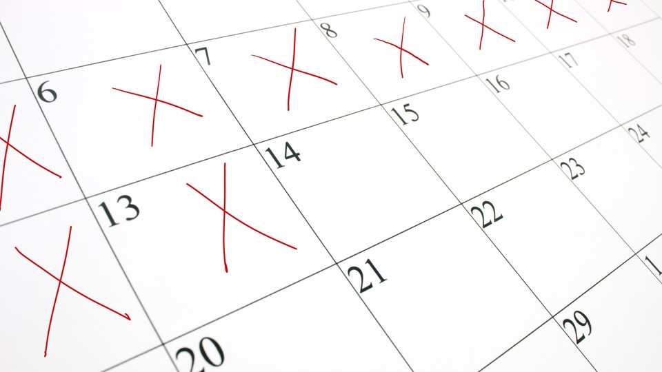 A close-up picture of a calendar with several days crossed off