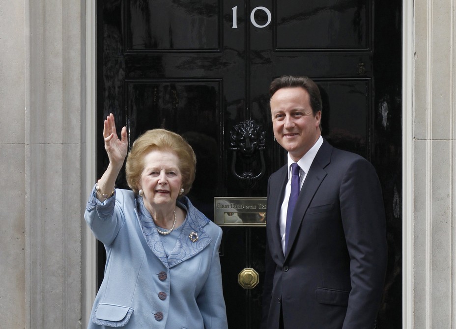 Margaret Thatcher and David Cameron stand outside Number 10 Downing Street.