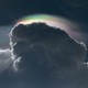 Artistic photo of a cloud in front of the sun