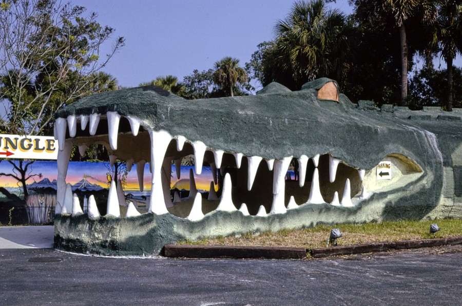 A giant alligator mouth stands at the entrance to an animal park.