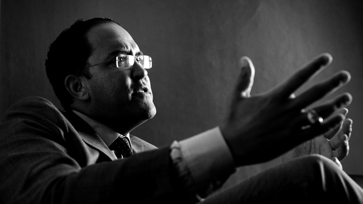 Will Hurd gesticulates in a black-and-white photo.