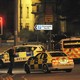 Armed police block a road near to the Manchester Arena in central Manchester, England, on May 23, 2017.