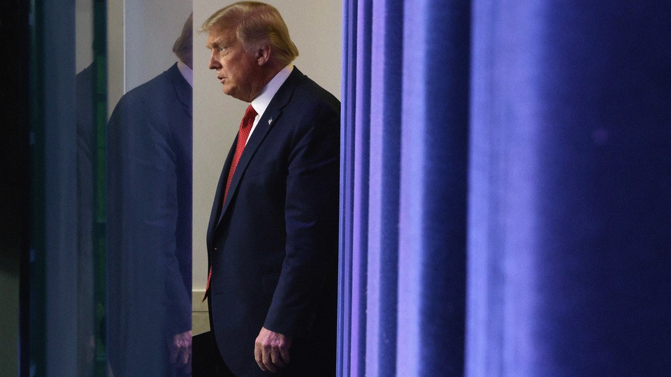 President Donald Trump walks offstage