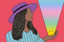 A woman stands holding a smiley face in her palm; a rainbow beam of light emanates from the smiley face to the heavens.