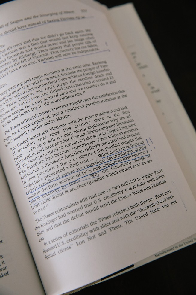 photo of a book's page with text underlined in blue pen and hand-written brackets and !! notations in margin