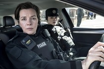 Two female cops from Blue Lights sit in a car