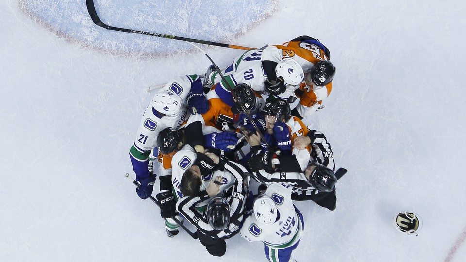 A bird's-eye view of a hockey fight