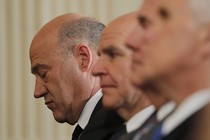 Gary Cohn looks downcast next to senior White House officials