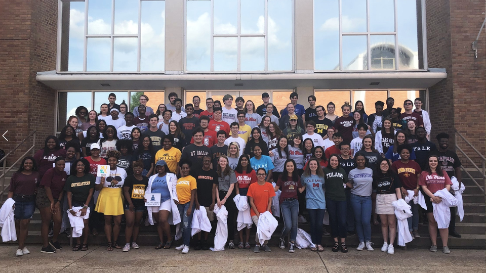 Seniors at the Mississippi School of Mathematics and Science are shown on "senior reveal day" this month. They wore white lab coats, and then pulled them off to reveal shirts of the colleges they will be attending.