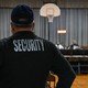 A Pennsbury School District security guard observes a Pennsbury School Board meeting