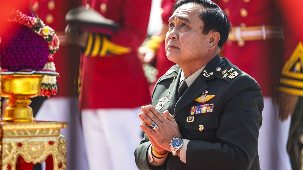 Prayuth Chan-ocha, the head of Thailand's military junta, prays at a military parade in 2014.